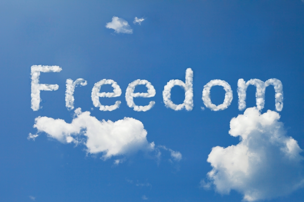 word Freedom in sky