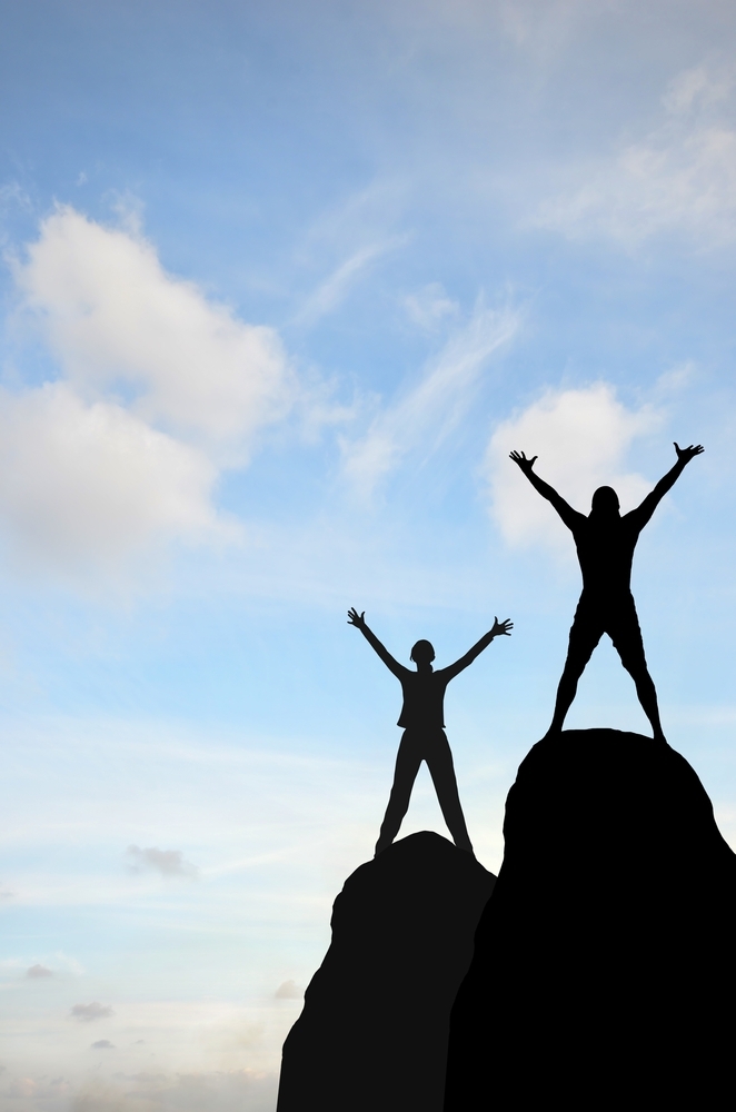 man and woman on mountaintop